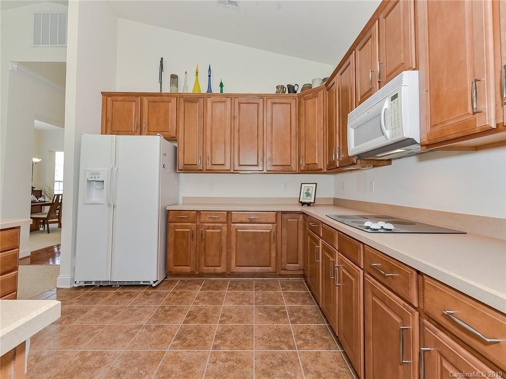 850 Platinum Drive Fort Mill, SC 29708 - Photo 25 of 47 a kitchen with stainless steel appliances granite countertop a refrigerator sink and cabinets