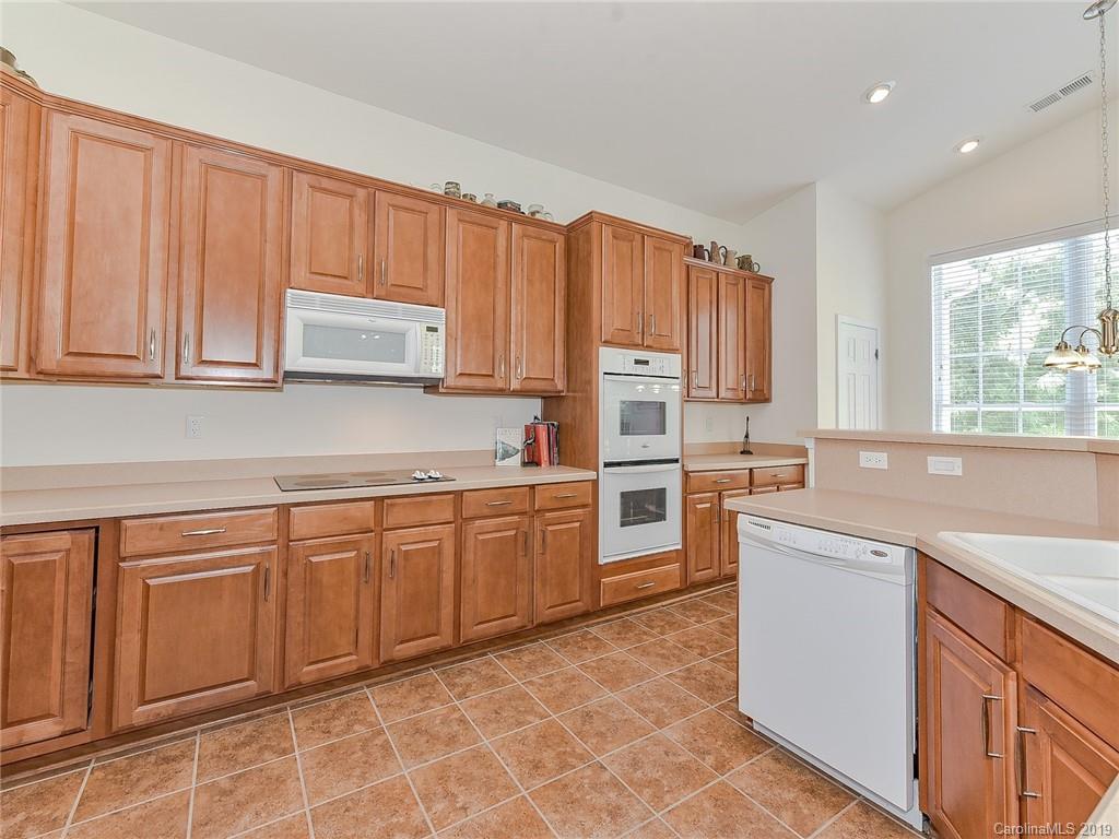 850 Platinum Drive Fort Mill, SC 29708 - Photo 28 of 47 a kitchen with cabinets appliances a sink and a counter top space
