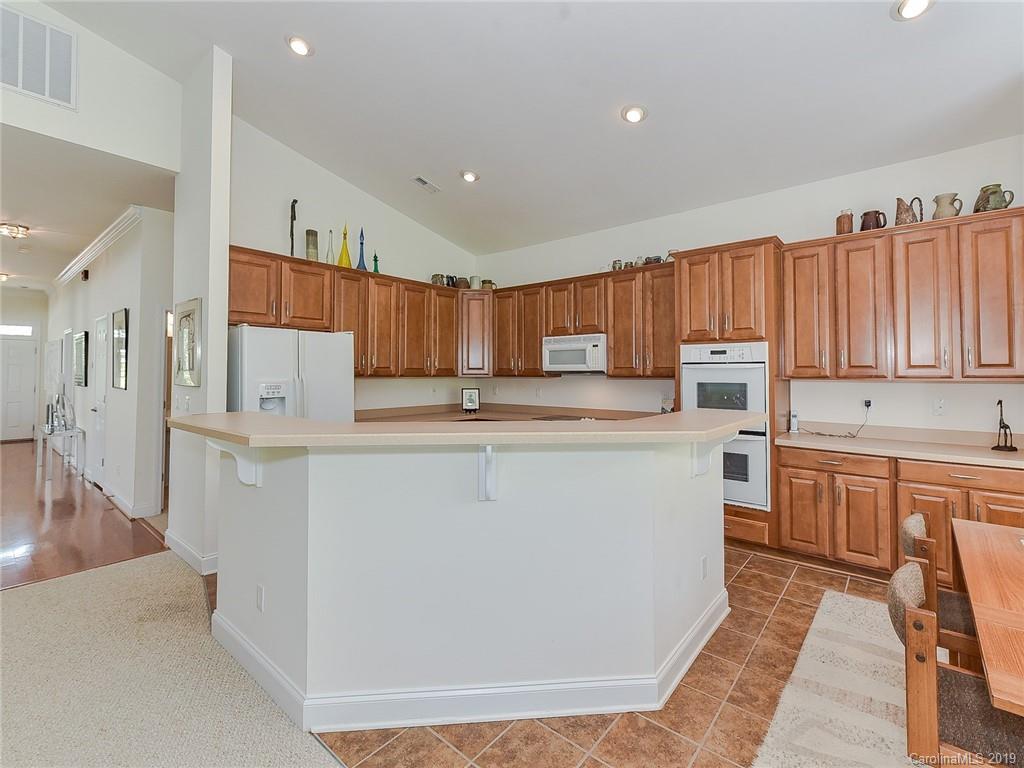 850 Platinum Drive Fort Mill, SC 29708 - Photo 29 of 47 a kitchen with stainless steel appliances granite countertop a refrigerator sink and cabinets