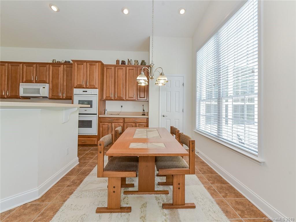 850 Platinum Drive Fort Mill, SC 29708 - Photo 31 of 47 a dining room with a table chairs and a refrigerator