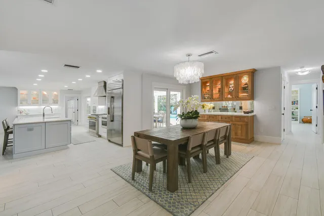 a spacious bathroom with a shower sink and mirror