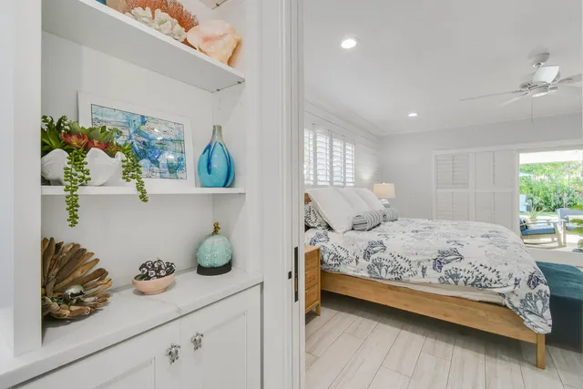 a bedroom with a bed and flat screen tv