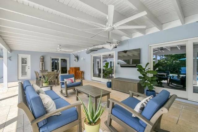 a view of a swimming pool with an outdoor space and seating area