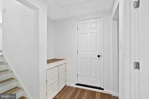 a bathroom with a sink a window and a toilet
