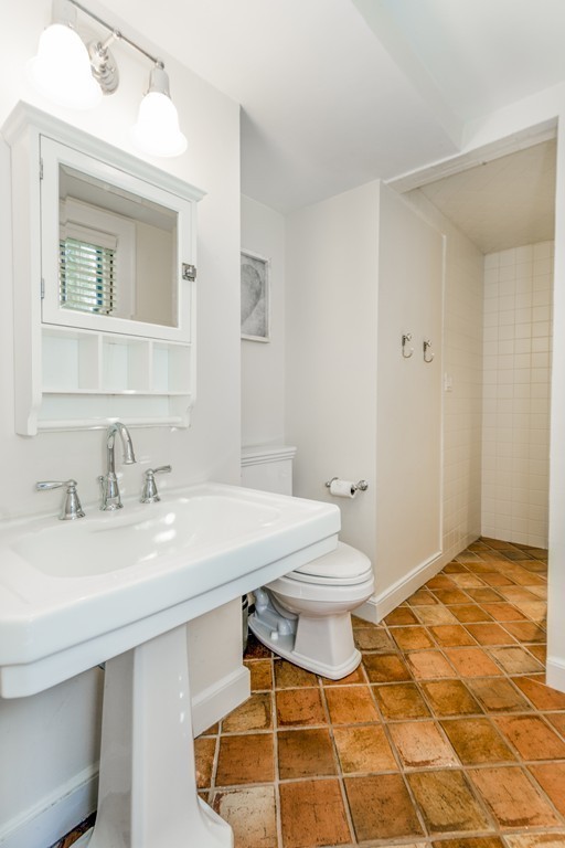 42 Plain Road Wayland, MA 01778 - Photo 15 of 21 a bathroom with a granite countertop sink a toilet and a mirror