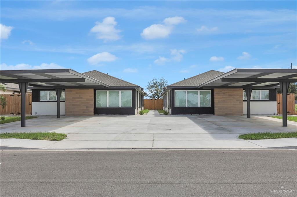 1620 Shadow Creek Drive, Unit 1 Weslaco, TX 78596 - Photo 2 of 11 front view of a house with a sink and a yard
