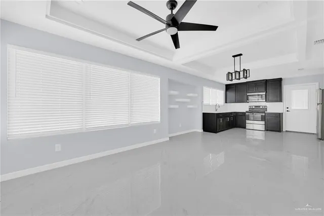 a view of kitchen with furniture and window