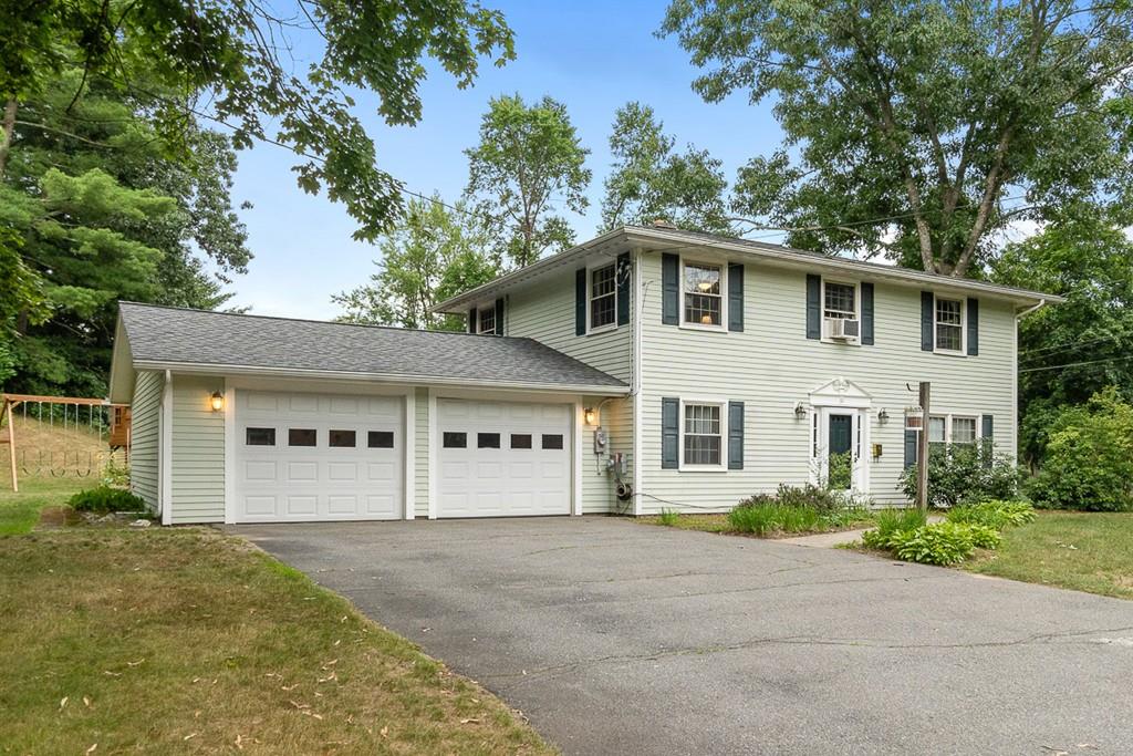 10 Craig Road Chelmsford, MA 01824 - Photo 1 of 34 a front view of a house with a garden