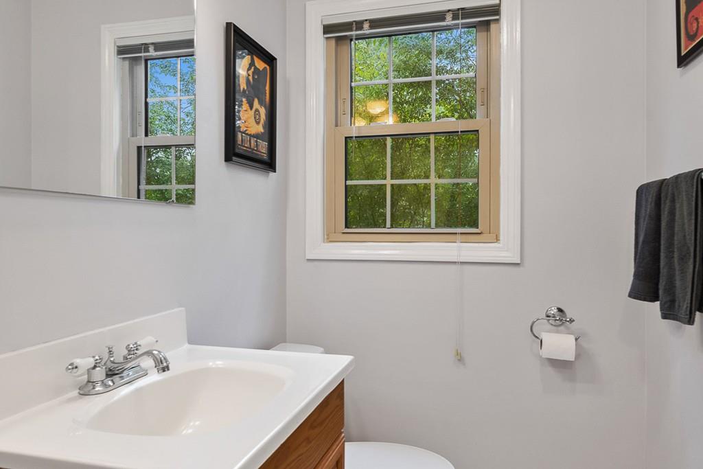 10 Craig Road Chelmsford, MA 01824 - Photo 17 of 34 a bathroom with a sink mirror and toilet