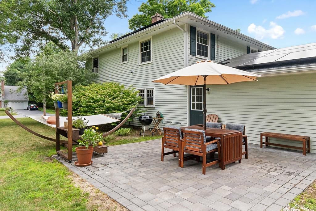 10 Craig Road Chelmsford, MA 01824 - Photo 3 of 34 a backyard of a house with table and chairs
