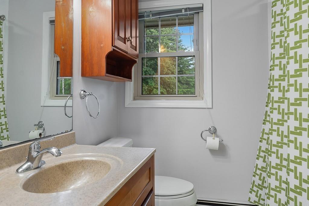 10 Craig Road Chelmsford, MA 01824 - Photo 31 of 34 a bathroom with a sink toilet and mirror