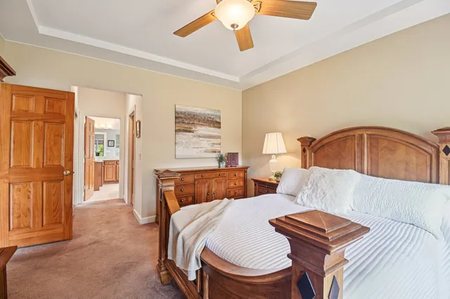 a bedroom with furniture and wooden floor