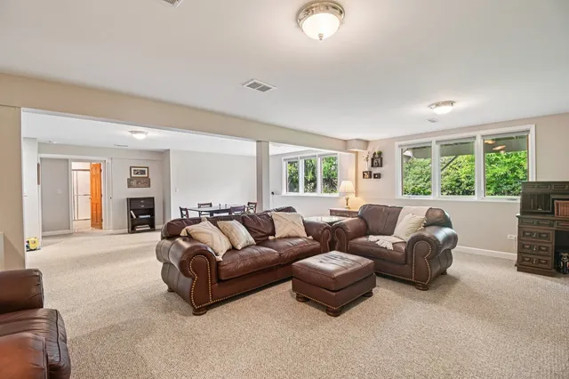 a dining room with furniture and window