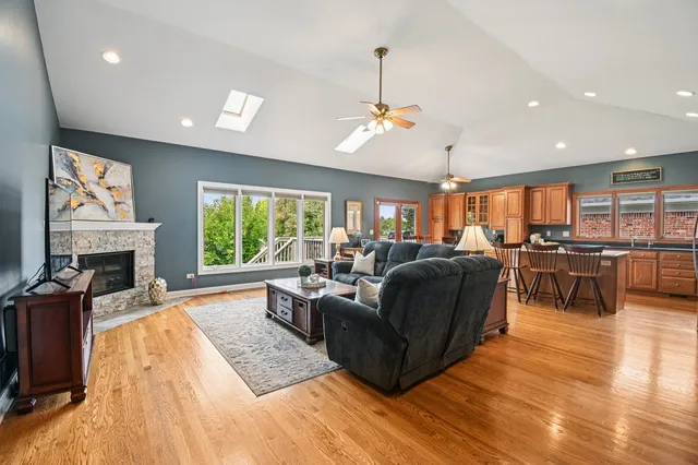 a living room with furniture fireplace and window
