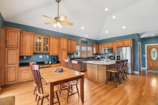 a kitchen with a table and chairs in it
