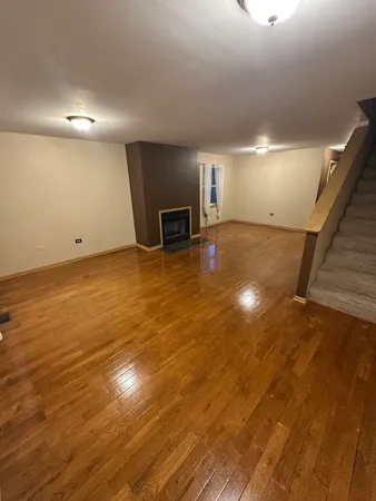 a view of a livingroom with wooden floor