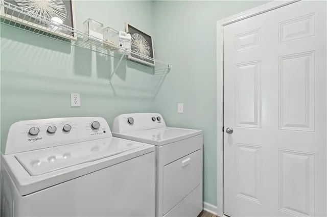 a utility room with dryer and washer