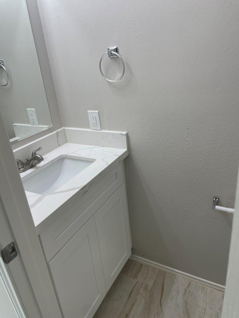 12704 Rio Nueces Lane Rosharon, TX 77583 - Photo 13 of 41 a bathroom with a sink and a mirror