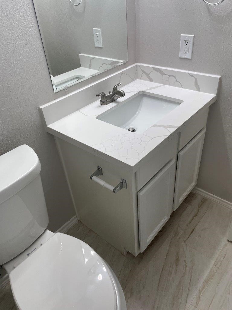 12704 Rio Nueces Lane Rosharon, TX 77583 - Photo 27 of 41 a bathroom with a sink and a toilet