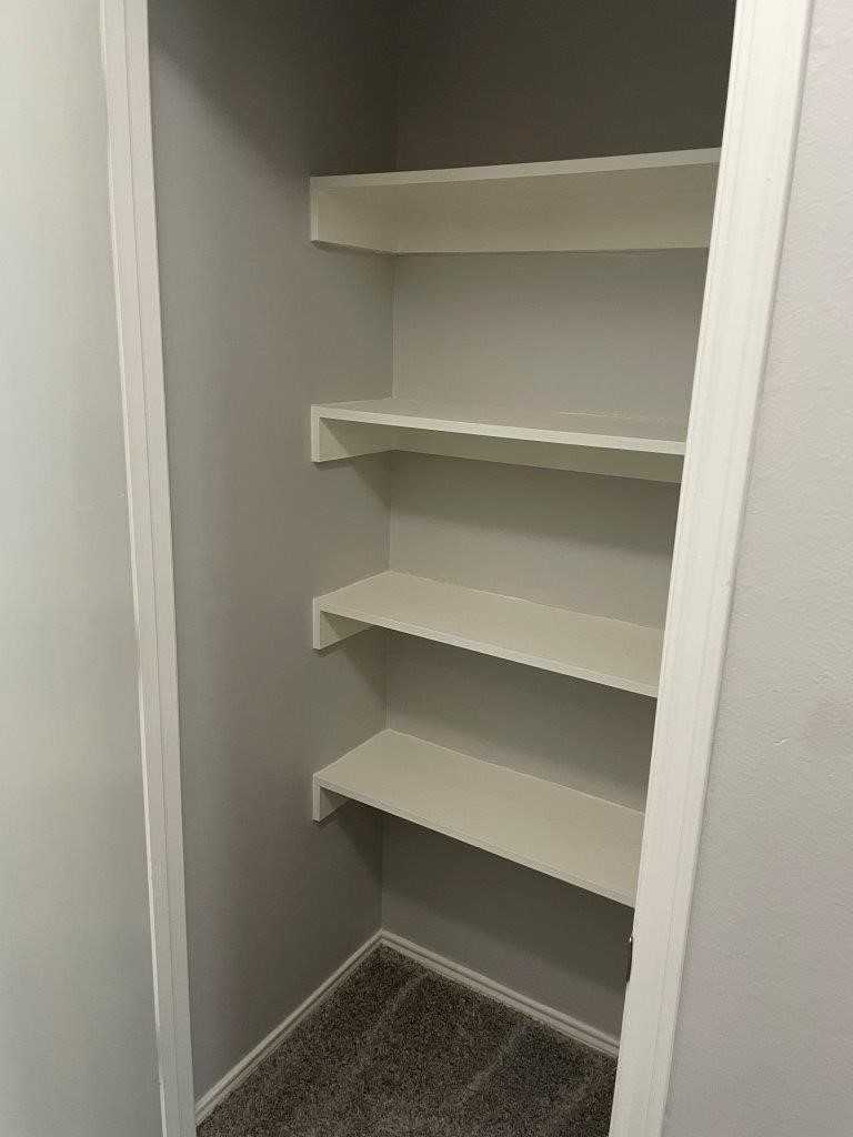 12704 Rio Nueces Lane Rosharon, TX 77583 - Photo 30 of 41 a view of walk in closet with empty racks