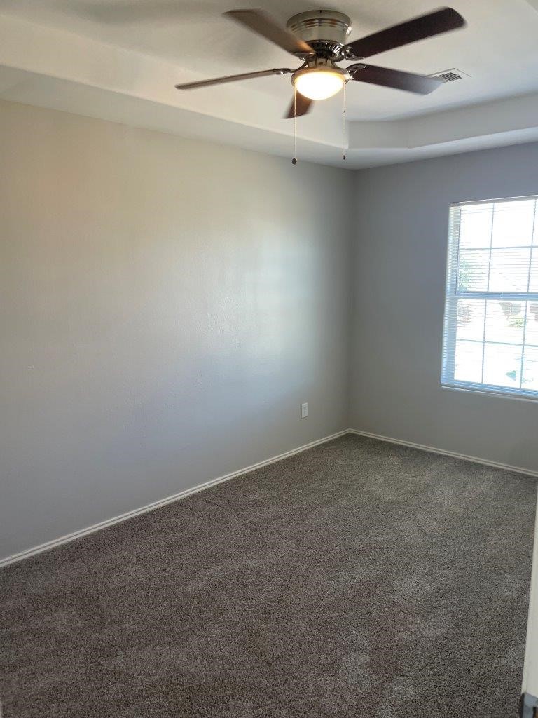 12704 Rio Nueces Lane Rosharon, TX 77583 - Photo 33 of 41 an empty room with a window and a fan