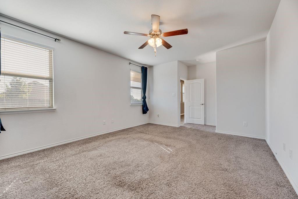 633 Bassett Hall Road Fate, TX 75189 - Photo 15 of 20 a view of an empty room with a window