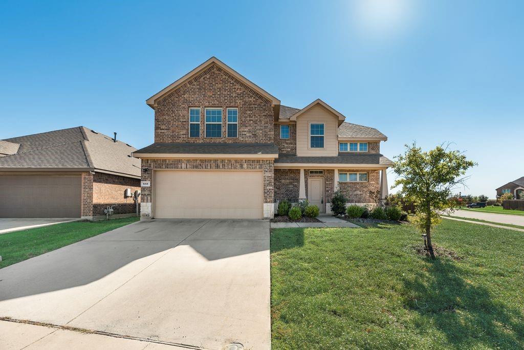 633 Bassett Hall Road Fate, TX 75189 - Photo 2 of 20 a front view of a house with a yard