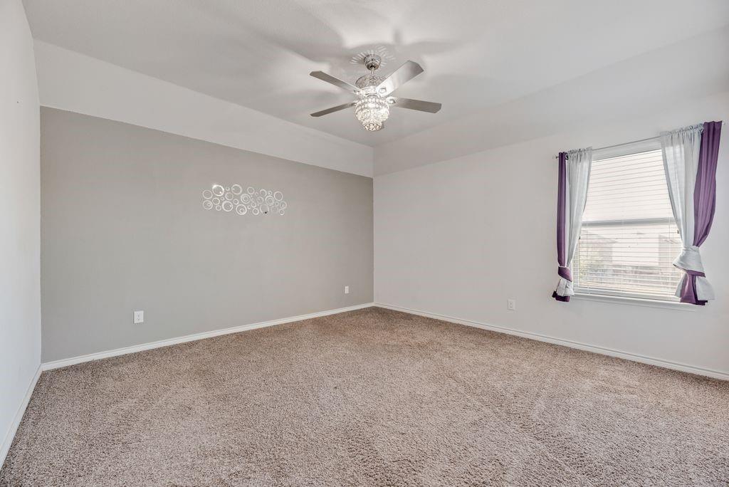 633 Bassett Hall Road Fate, TX 75189 - Photo 6 of 20 a view of an empty room with a window