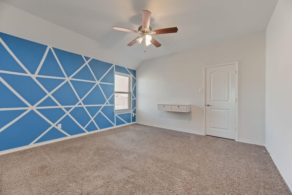 633 Bassett Hall Road Fate, TX 75189 - Photo 9 of 20 a view of an empty room with a window