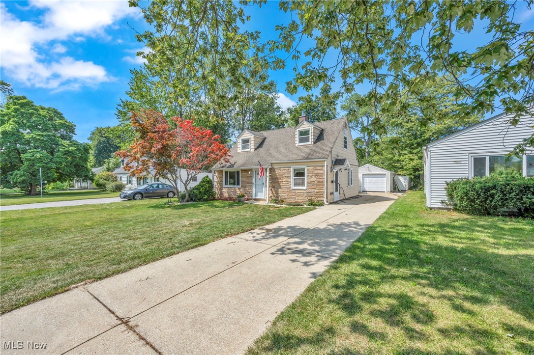 5038 Forest Road Mentor, OH 44060 - Photo 3 of 29 Cape cod home with an outdoor structure, a front yard, and a garage
