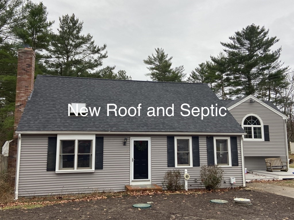 a front view of a house with garage