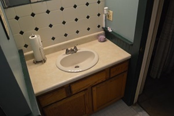 12 Summer Street Wareham, MA 02571 - Photo 15 of 24 a bathroom with a sink and a mirror