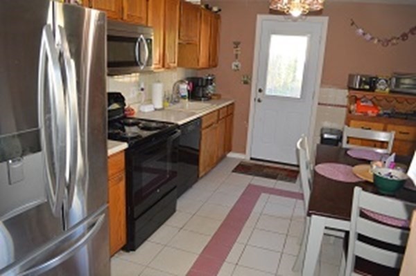 12 Summer Street Wareham, MA 02571 - Photo 19 of 24 a kitchen with stainless steel appliances granite countertop a refrigerator stove and sink