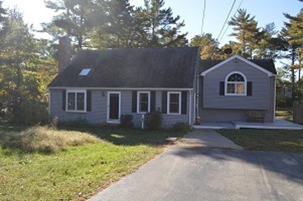 12 Summer Street Wareham, MA 02571 - Photo 7 of 24 a front view of a house with a garden and yard
