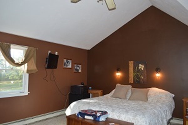 12 Summer Street Wareham, MA 02571 - Photo 10 of 24 a bedroom with a bed a mirror and night stand