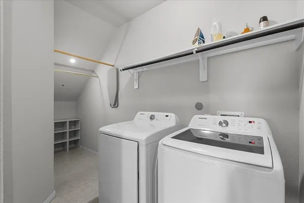a utility room with dryer and washer