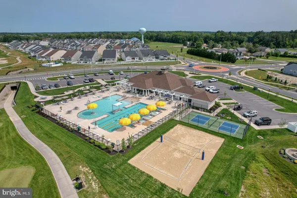 an aerial view of a house with a swimming pool