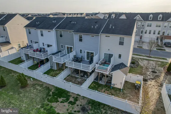 an aerial view of a house with backyard