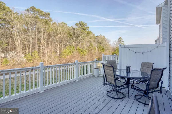 a view of a chairs on the roof deck