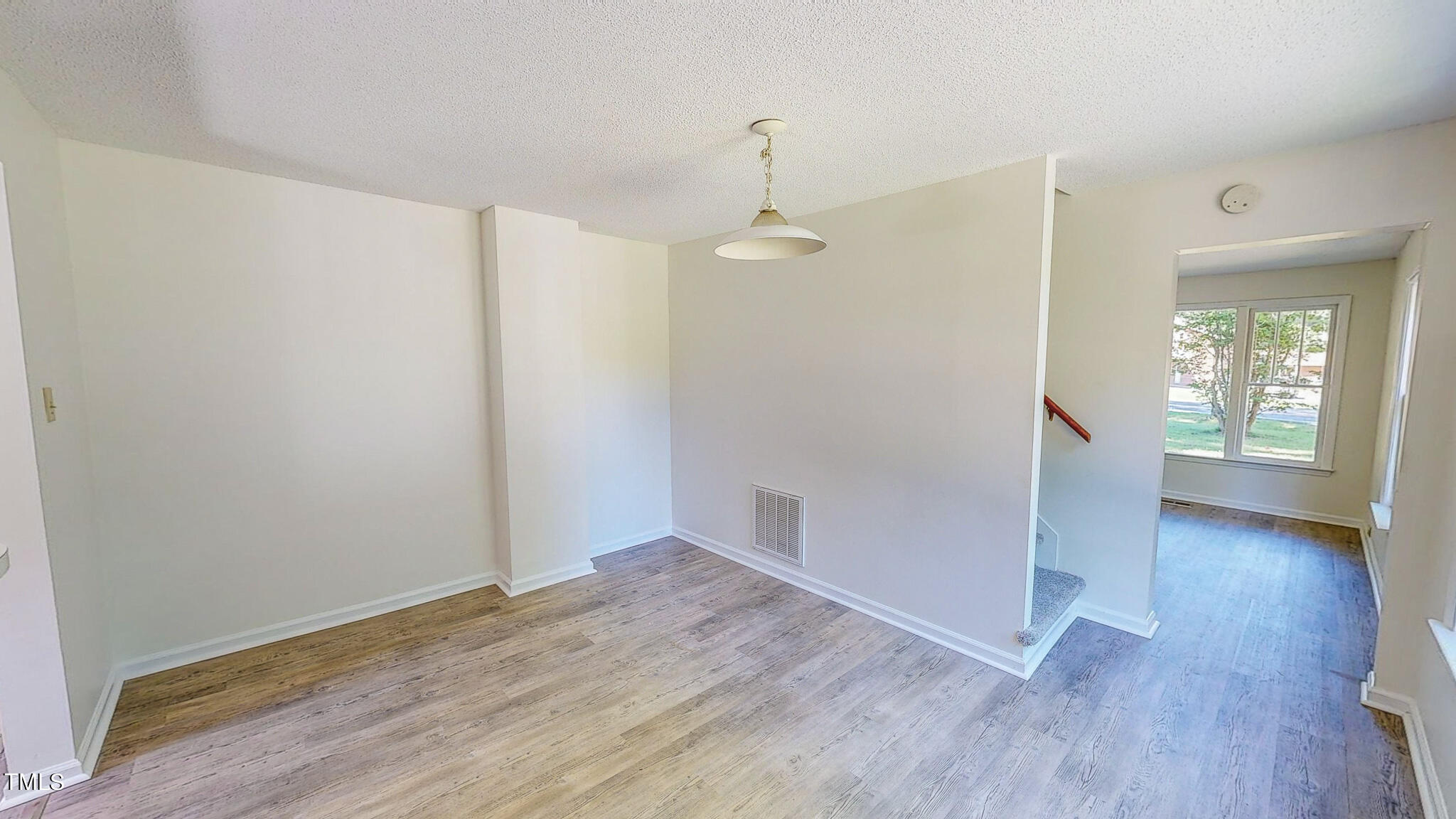 3906 Cole Mill Road Durham, NC 27712 - Photo 11 of 33 wooden floor in an empty room with a window
