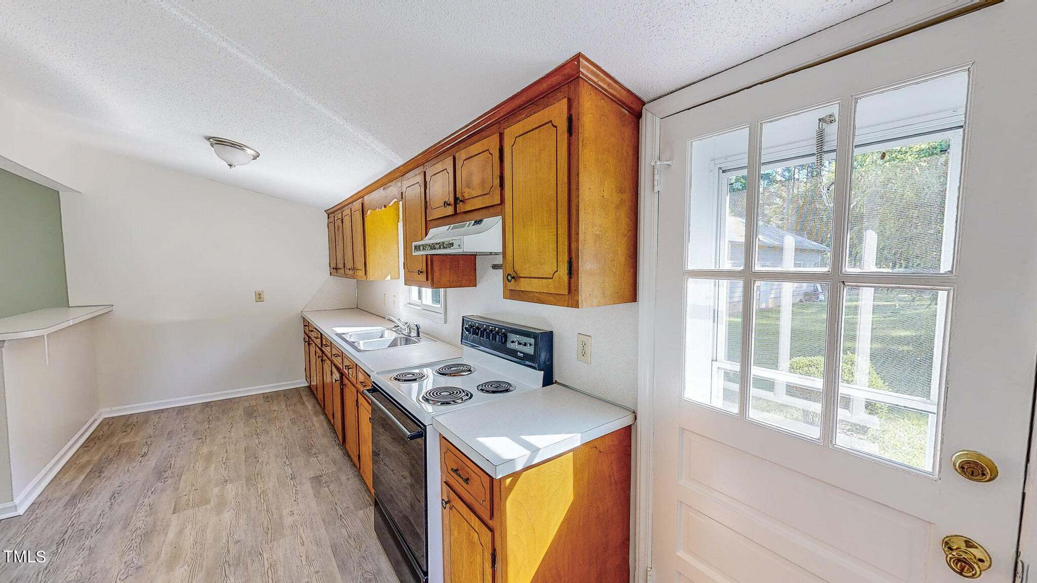3906 Cole Mill Road Durham, NC 27712 - Photo 14 of 33 a kitchen that has a stove and a table in it