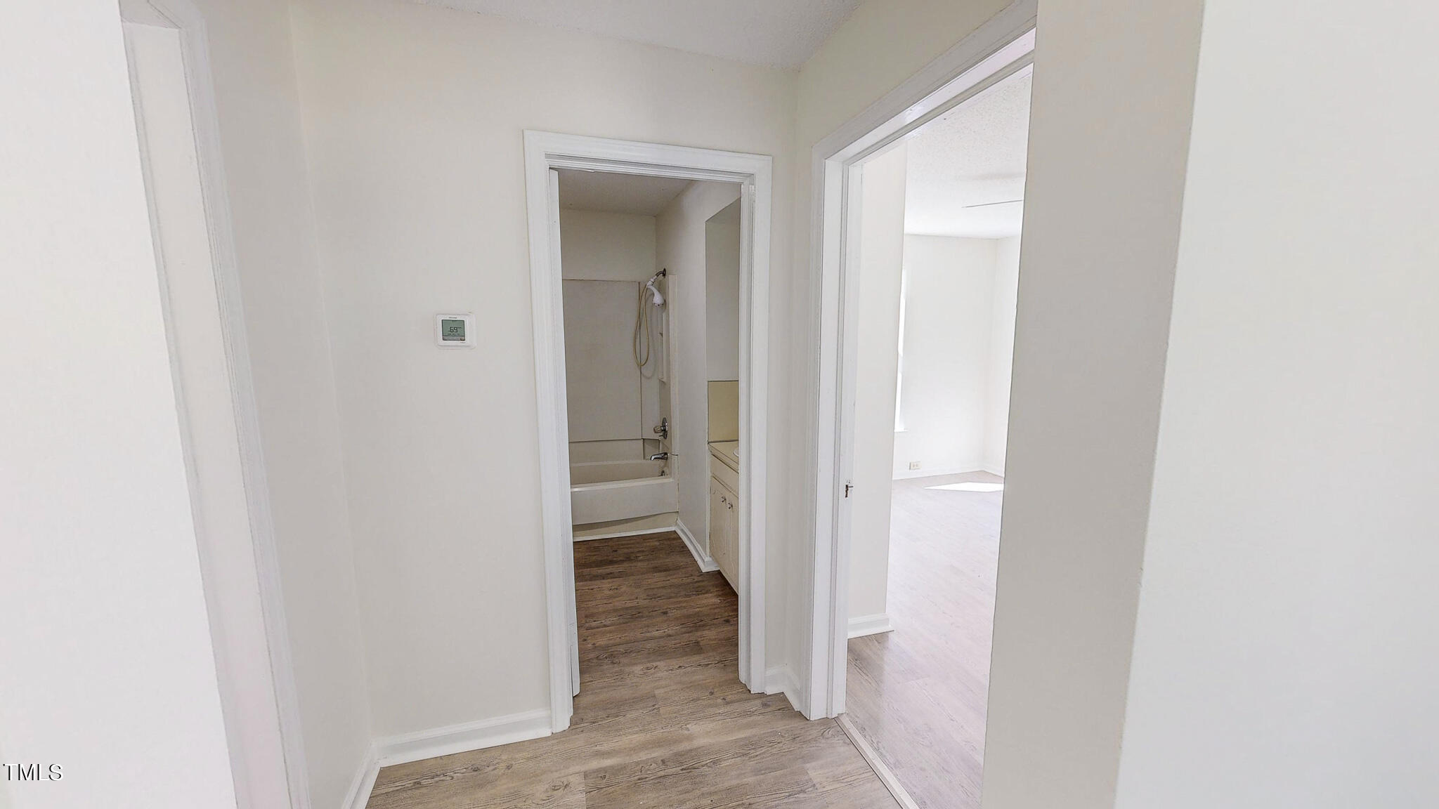 3906 Cole Mill Road Durham, NC 27712 - Photo 16 of 33 a view of a bathroom from a hallway
