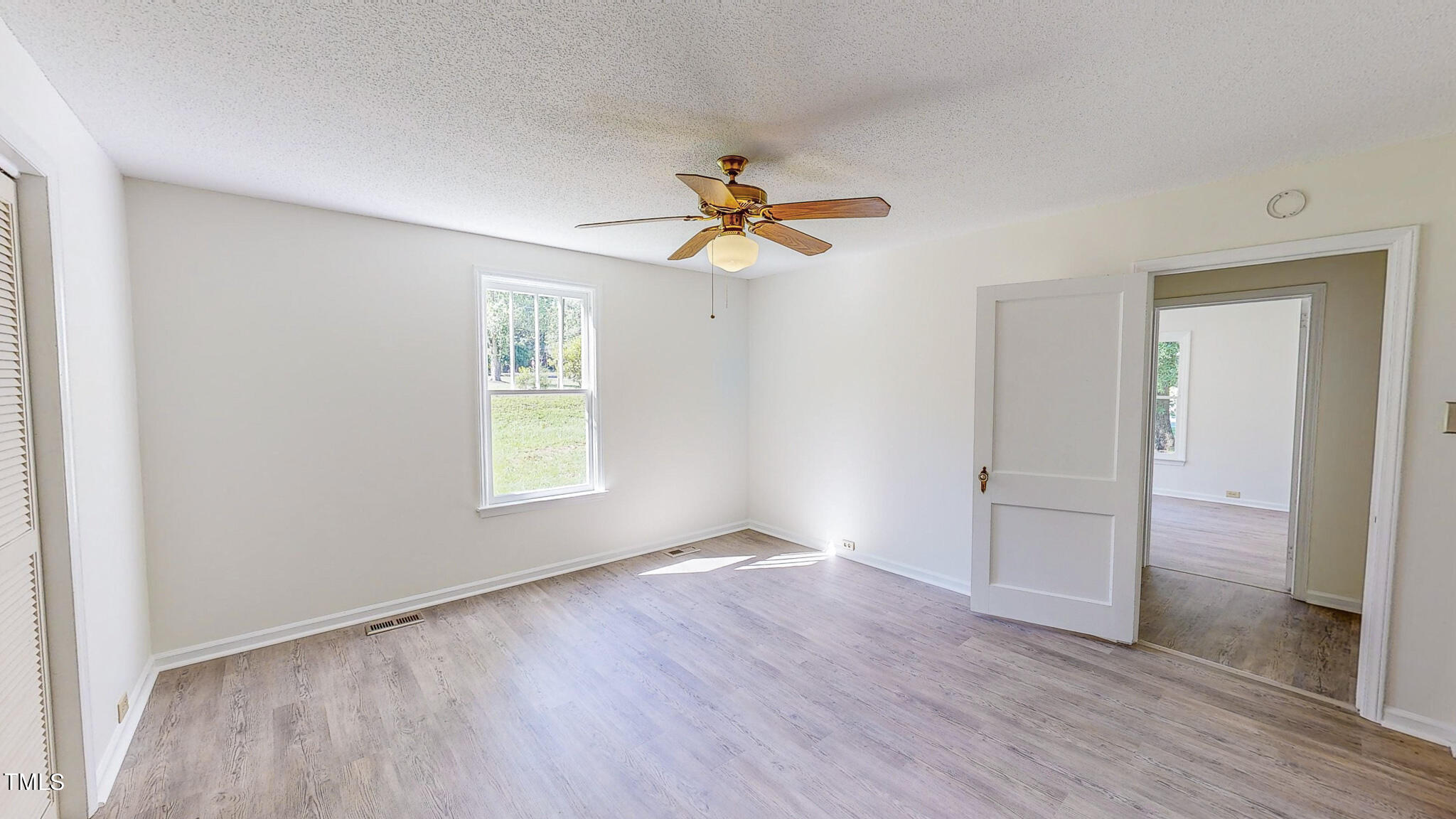 3906 Cole Mill Road Durham, NC 27712 - Photo 21 of 33 wooden floor in an empty room with a window