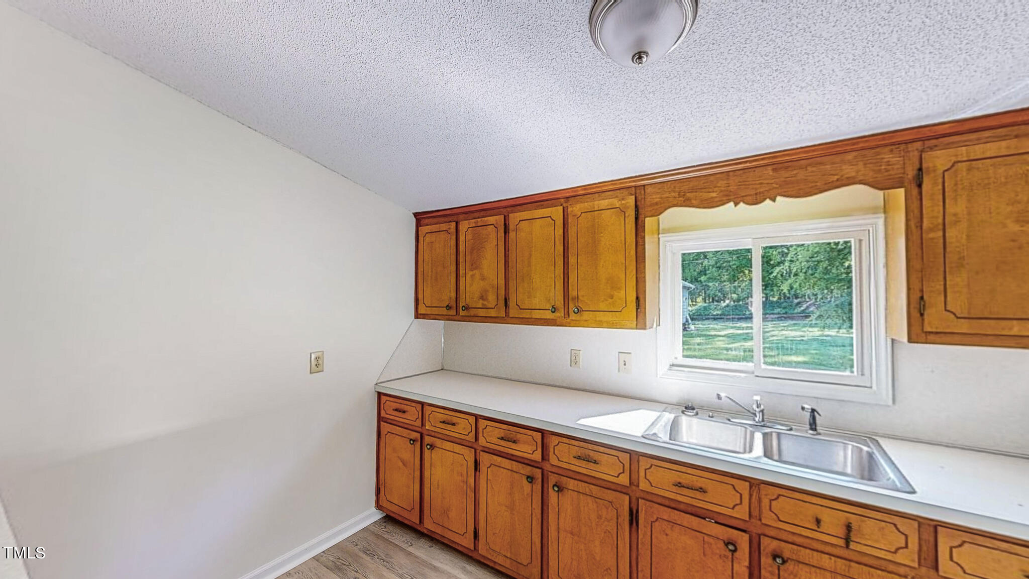 3906 Cole Mill Road Durham, NC 27712 - Photo 25 of 33 a bathroom with a sink and a window