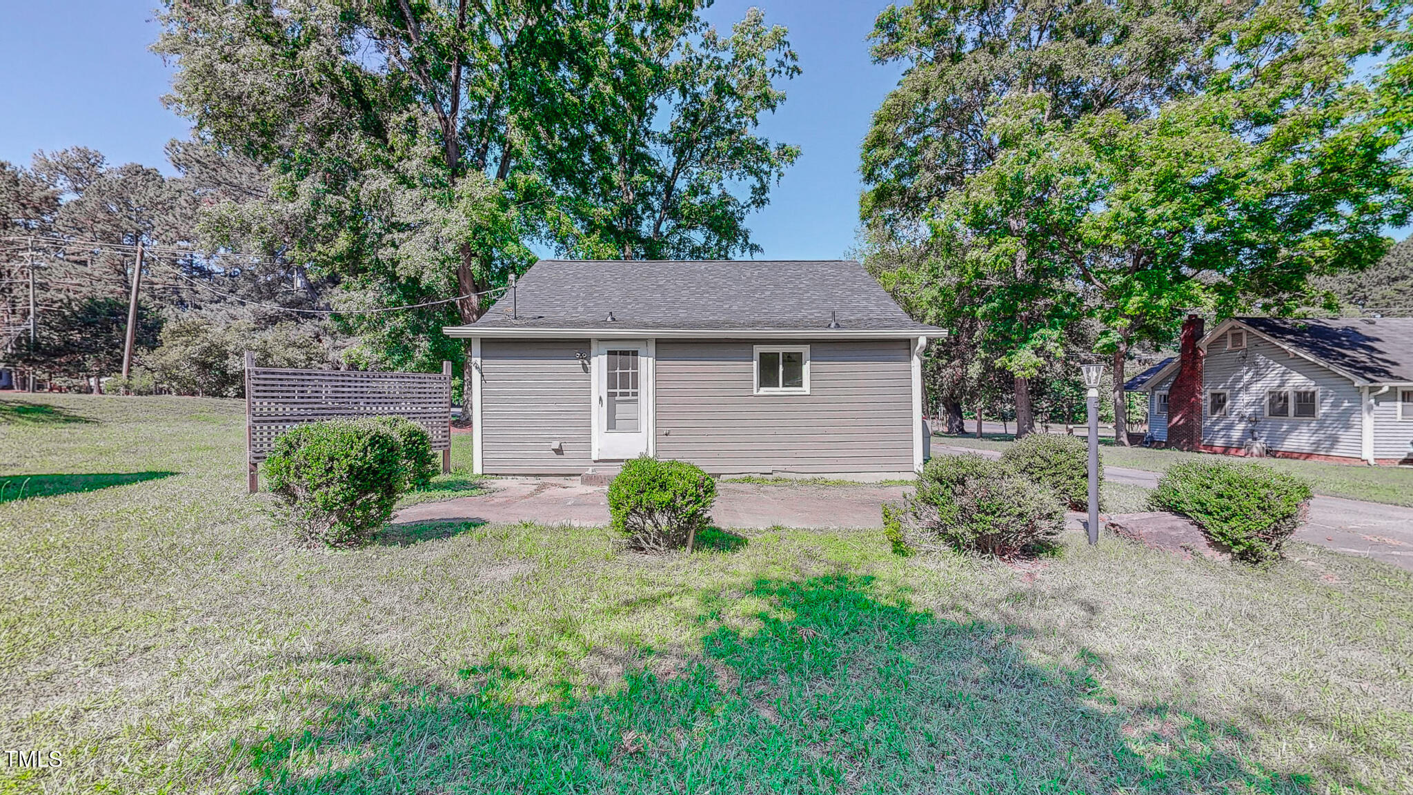 3906 Cole Mill Road Durham, NC 27712 - Photo 30 of 33 a view of backyard with potted plants and large tree