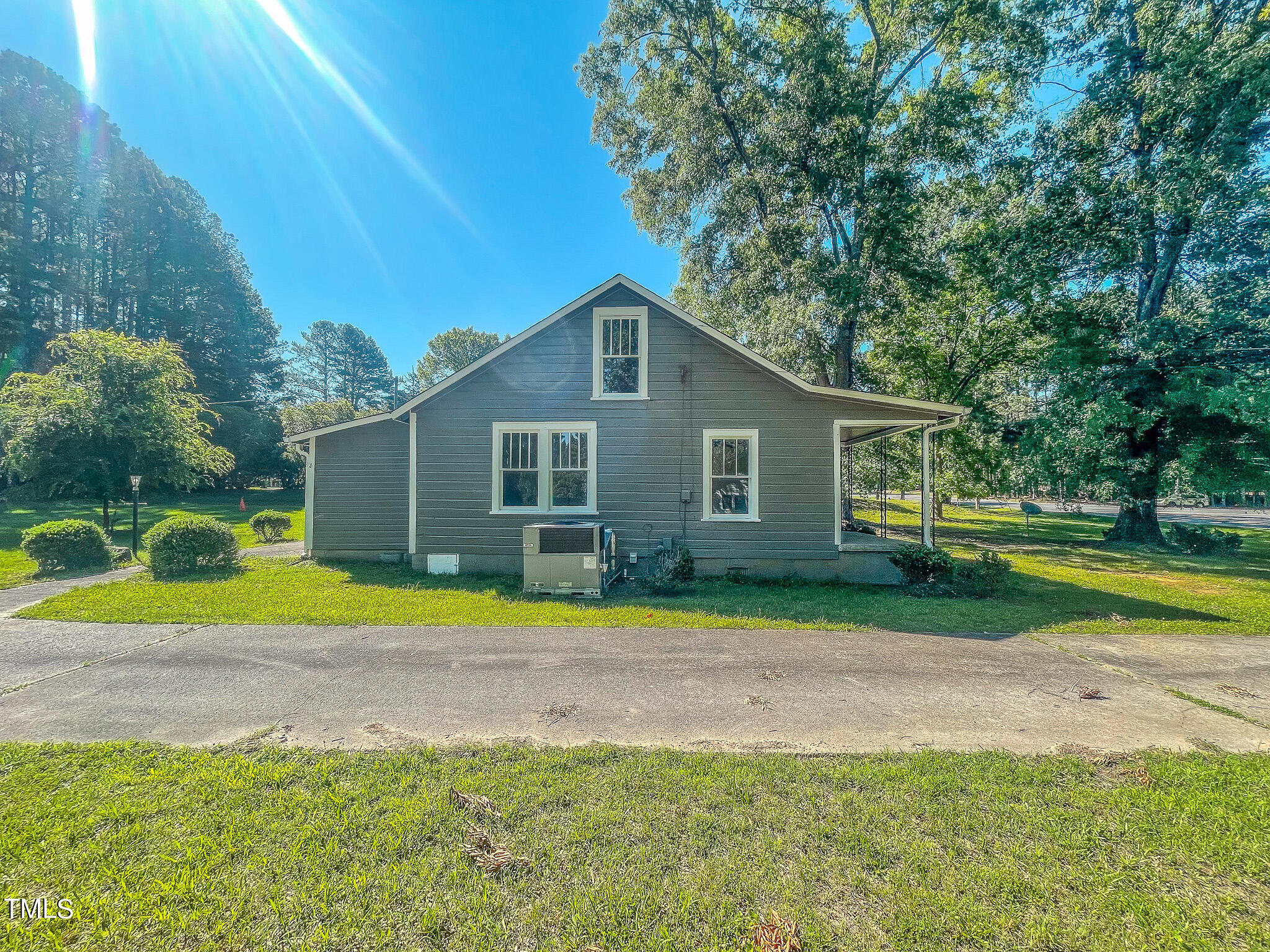 3906 Cole Mill Road Durham, NC 27712 - Photo 31 of 33 a front view of a house with a yard and trees