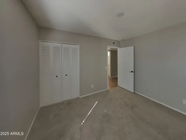 a view of a bathroom with a sink and mirror