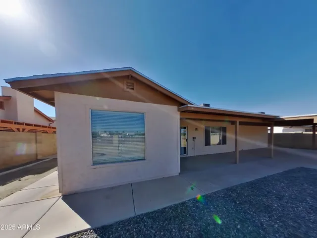 a view of an empty room and fire place
