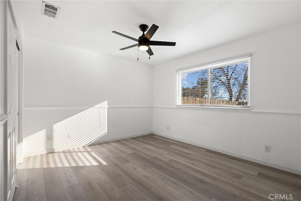 2067 Blossom Avenue Corning, CA 96021 - Photo 15 of 37 a view of empty room with wooden floor and fan