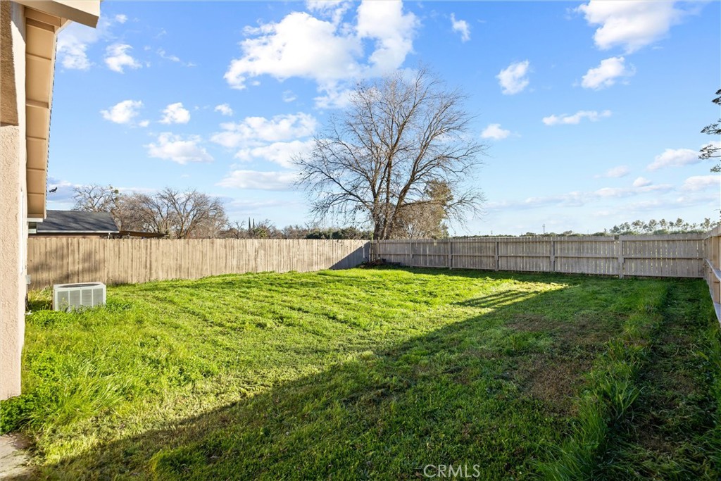 2067 Blossom Avenue Corning, CA 96021 - Photo 31 of 37 a view of yard with swimming pool and green space